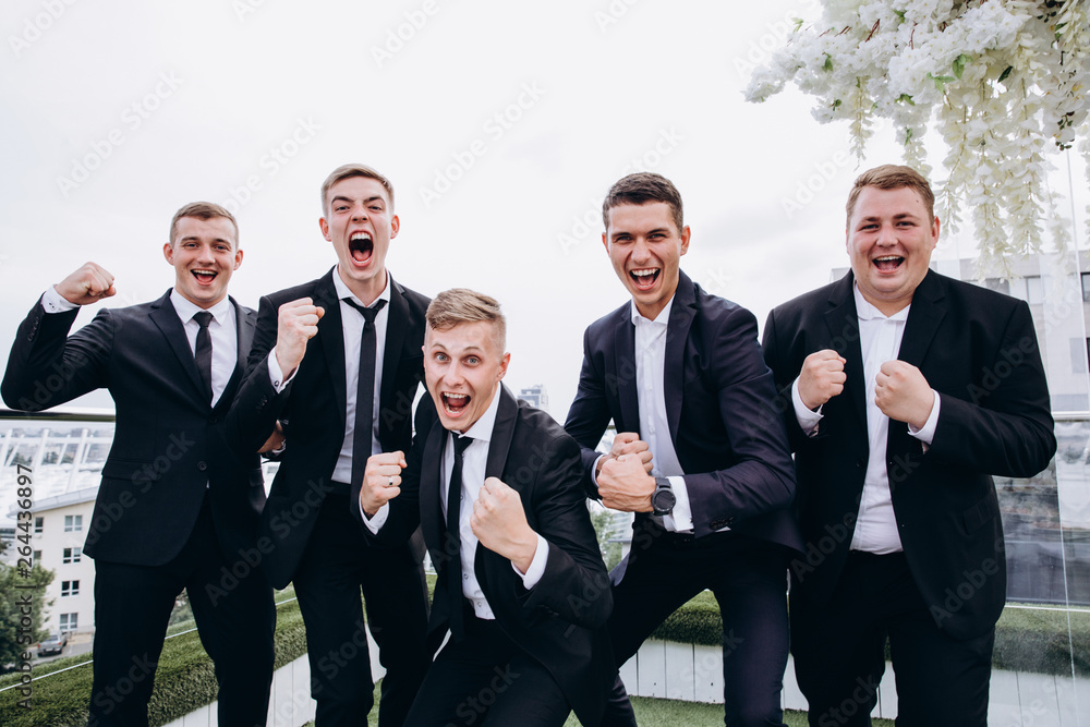 Friends congratulate the groom. Merry wedding. Friends congratulate the groom. Merry wedding.