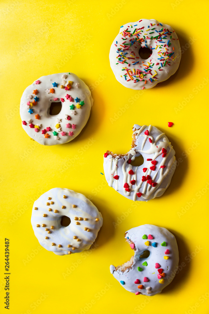 donut, donut classic, donut for an old recipe, ukrainian donuts on a on a yellow background. Donuts whole and bitten. space for text