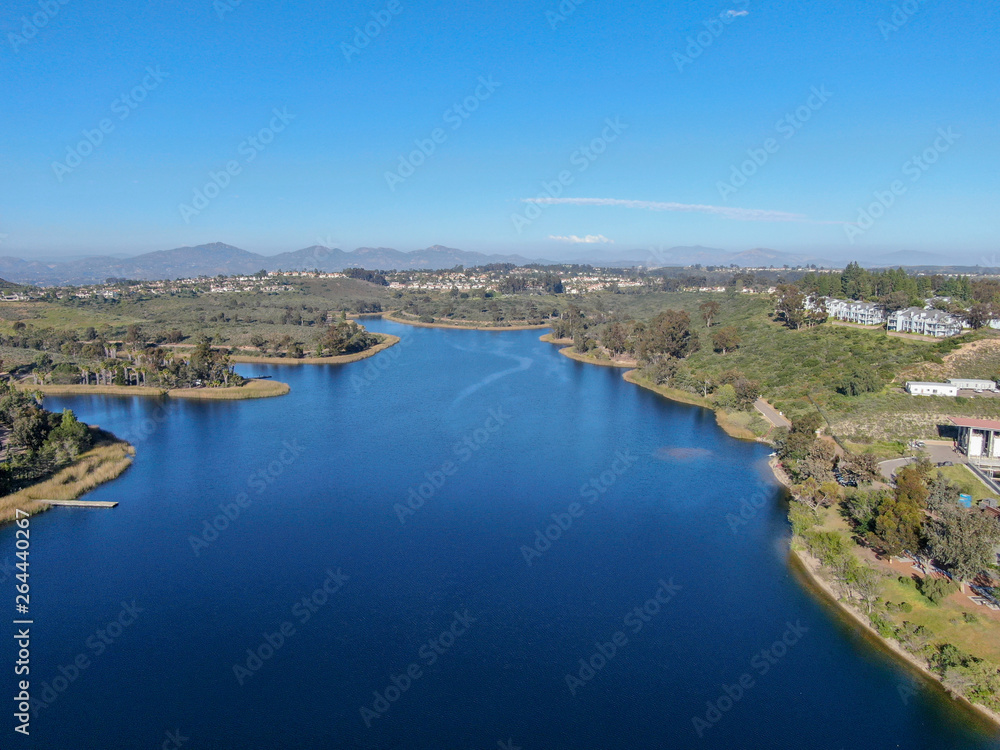 Aerial view of Miramar reservoir in the Scripps Miramar Ranch community, San Diego, California. Miramar lake, popular activities recreation site including boating, fishing, picnic & 5-mile-long trail.