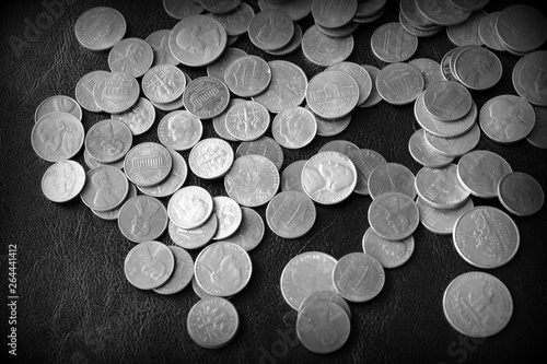 American cents on a dark surface close up. Black and white