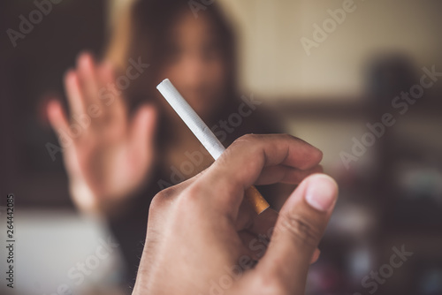 Asian woman make hand Refuse  cigarette.Quitting from addiction concept No tobacco day No smoking concept Just say no