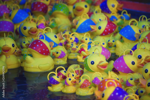Plastic yellow ducks in a fair, France.