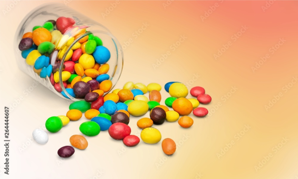 Obraz premium Assortment of colorful candies isolated on white background