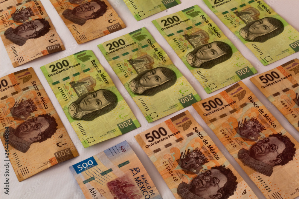 top view mexican pesos with white background (bills of different denominations) top view mexican pesos with white background (bills of different denominations)
