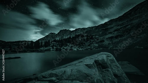 Motion time lapse of changing night sky over Cecret Lake, Utah photo
