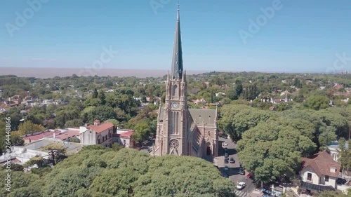 aerial view of the cathedral surrounded by green trees and the river in the background - Buenos Aires - San Isidro photo