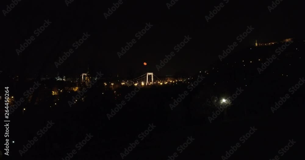 Orange moon over the downtown of Budapest at night. Orange moon over the downtown of Budapest at night.