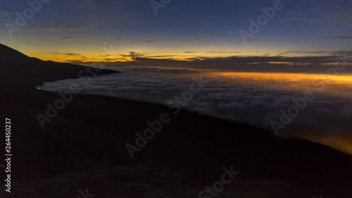 Highlighted sea of clouds on tenerife in the blue hour. photo