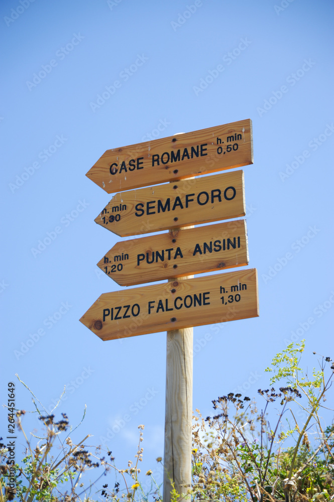Wooden public footpath signs - Marettimo, Sicily, Italy - Some explanations to Marettimo on the routes to go to Punta Troia or other beautiful places and trails.