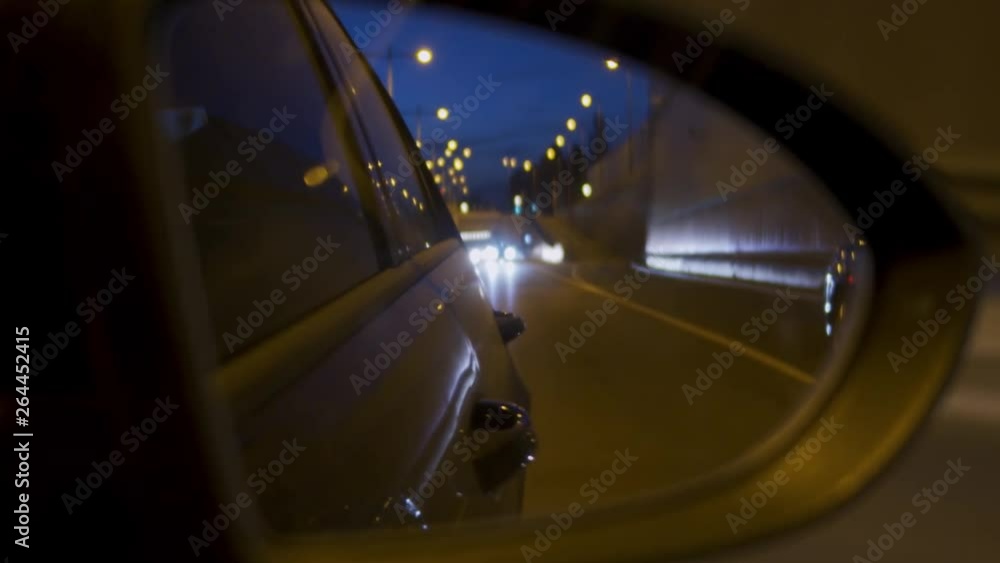 Reflective cars in the side mirror at night Reflective cars in the side mirror at night