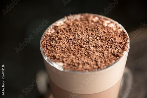 latte with chocolate pieces on top. Macro photography. Hot drink.