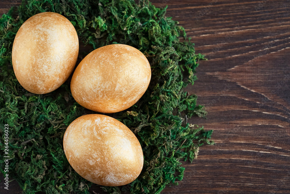 golden painted eggs on a wooden background Happy Easter golden painted eggs on a wooden background Happy Easter