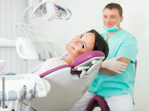 smiling woman patient with dentist