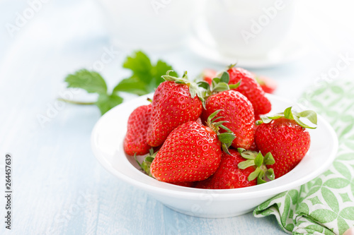 Fresh strawberry in bowl on table