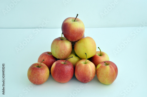 Group of red apples with their leaves