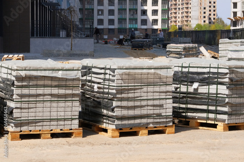 Construction Materials. Building materials for construction of residential complex. Pile of gray bricks at construction site.