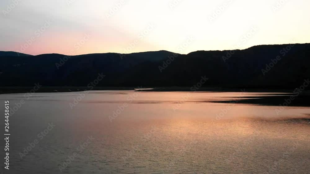 Aerial view of lake in sunset and mountains Aerial view of lake in sunset and mountains