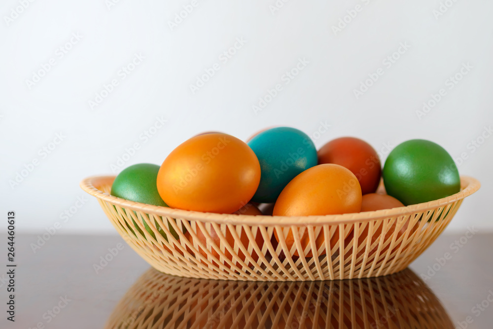 Painted multi-colored paint Easter eggs with a basket Painted multi-colored paint Easter eggs with a basket
