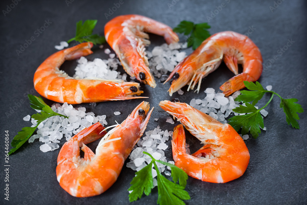 boiled shrimps with salt and lemon are beautiful against a dark background boiled shrimps with salt and lemon are beautiful against a dark background