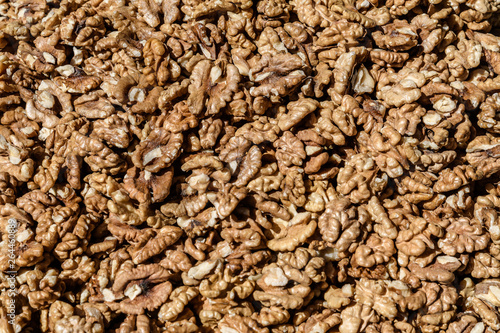 Large group of fresh walnut kernels sold at a spice food market, organic food background