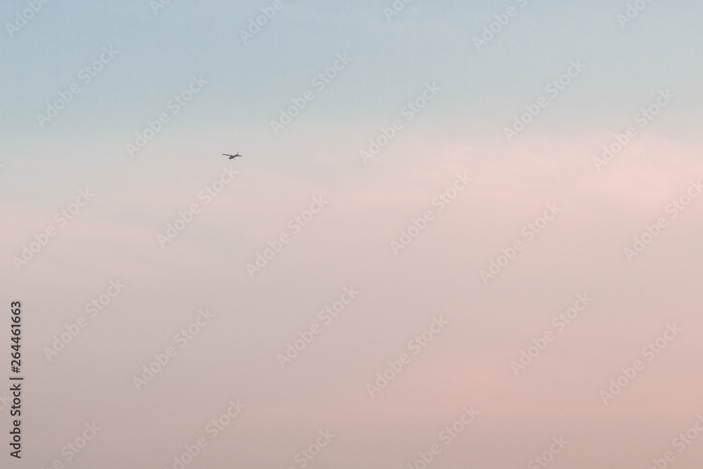 Beautiful sunset sky with feathery pink clouds in spring