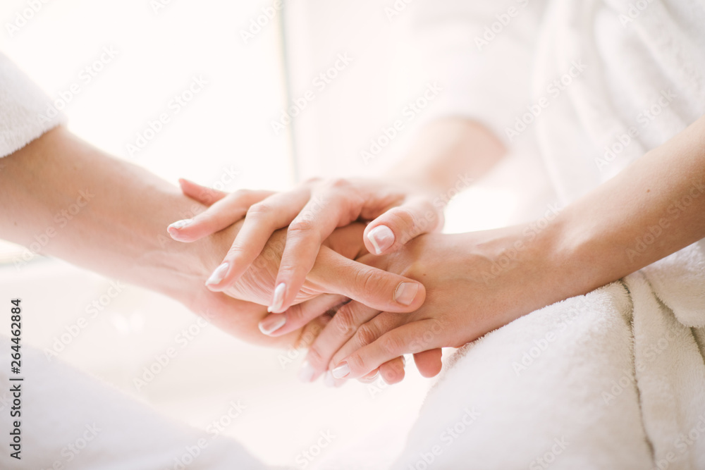 Man and woman hold hands close up Man and woman hold hands close up