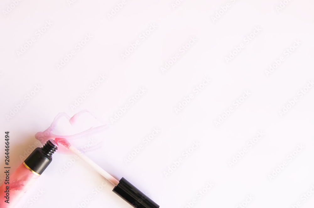 Pink lip gloss on a white background. Pink lip gloss on a white background.