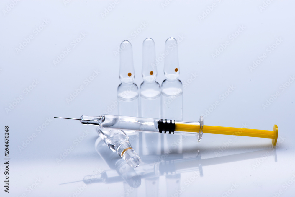 syringe close up. ampoules for injection. syringe close up. ampoules for injection.