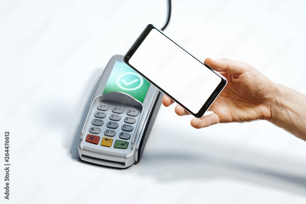 Hand, mobile phone with blank screen and POS payment terminal. 3d rendering. Hand, mobile phone with blank screen and POS payment terminal. 3d rendering.
