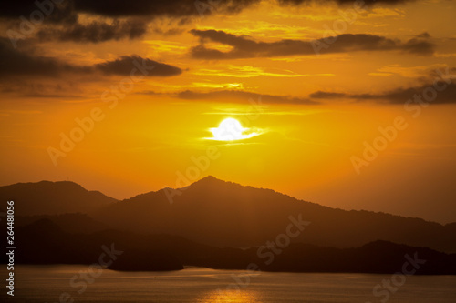 Distant Sunrise Over Pacific Island