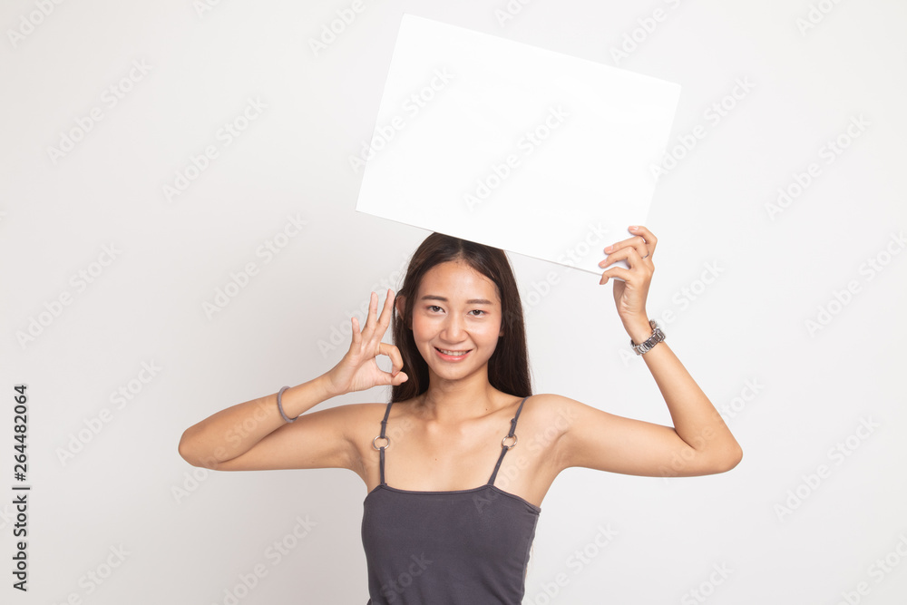 Young Asian woman show OK with white blank sign. Young Asian woman show OK with white blank sign.