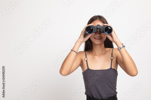 Young Asian woman with binoculars.