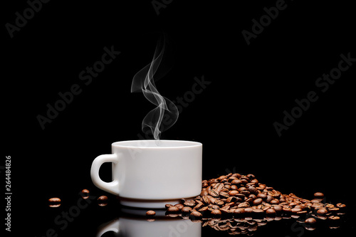 coffe  beans and cup on black background photo
