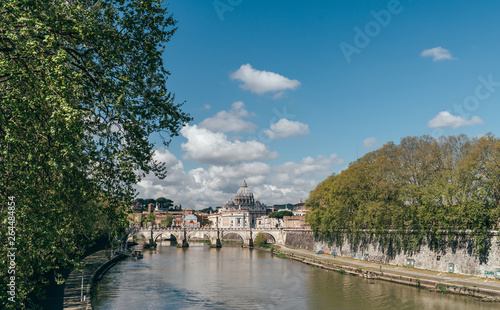 Tiber river cityscape in the Rome city centre with St. Peter's Basilica (Vatican) on the background.