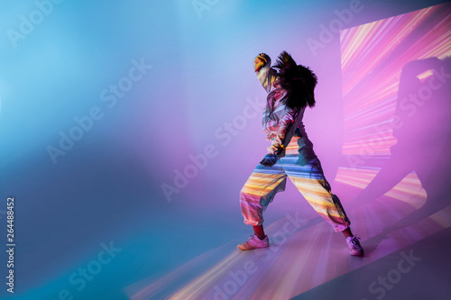 Female dancer under bright light photo