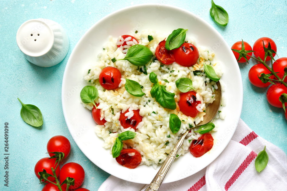 Risotto with grilled tomatoes.Top view with copy space.