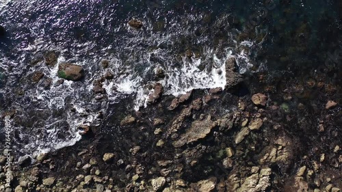 Wallpaper Mural Dark waves breaking on rocky black beach, Aerial Rising Top View Torontodigital.ca