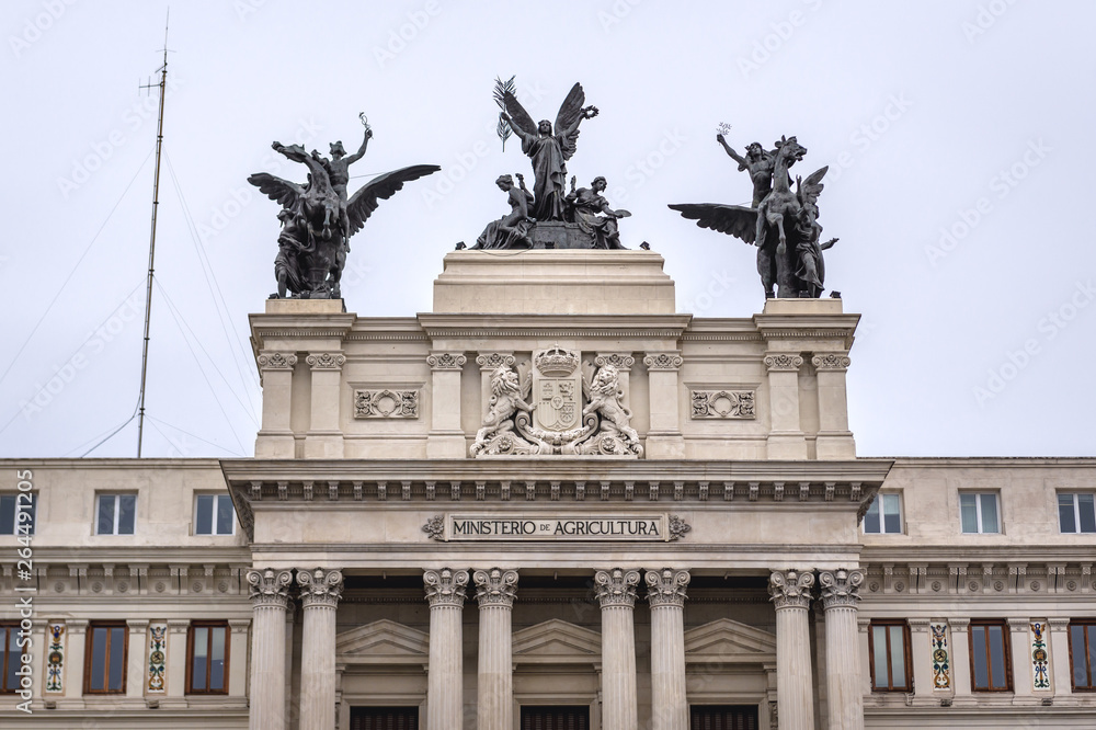 Sculptures on a top of Formento Palace, seat of Agriculture Ministry in Madrid, capital city of Spain