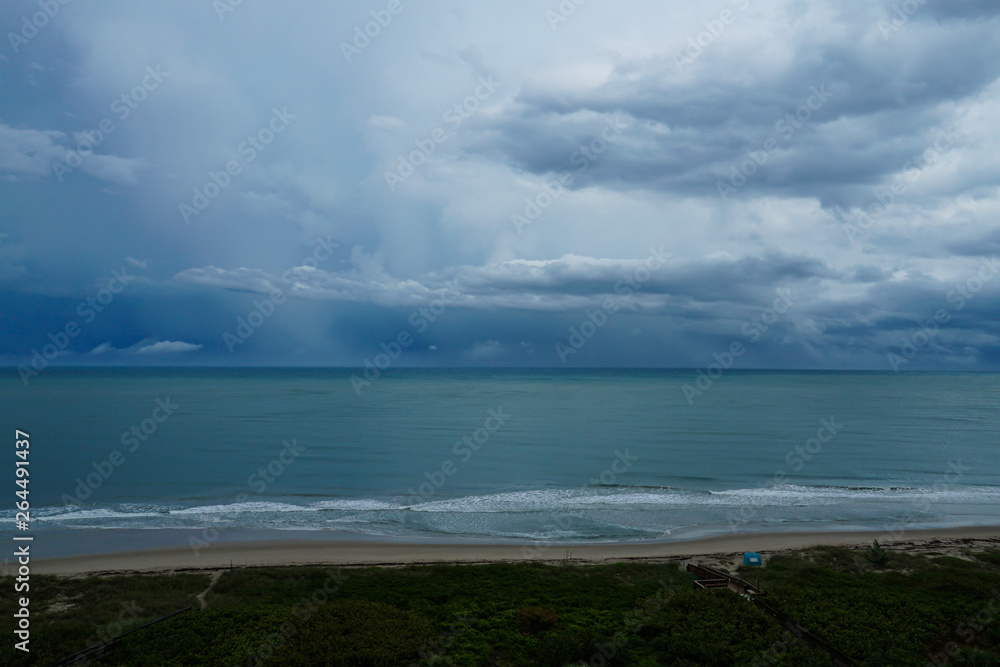 Stormy rainy day at the beach on North Hutchinson Island, Florida with storm clouds.