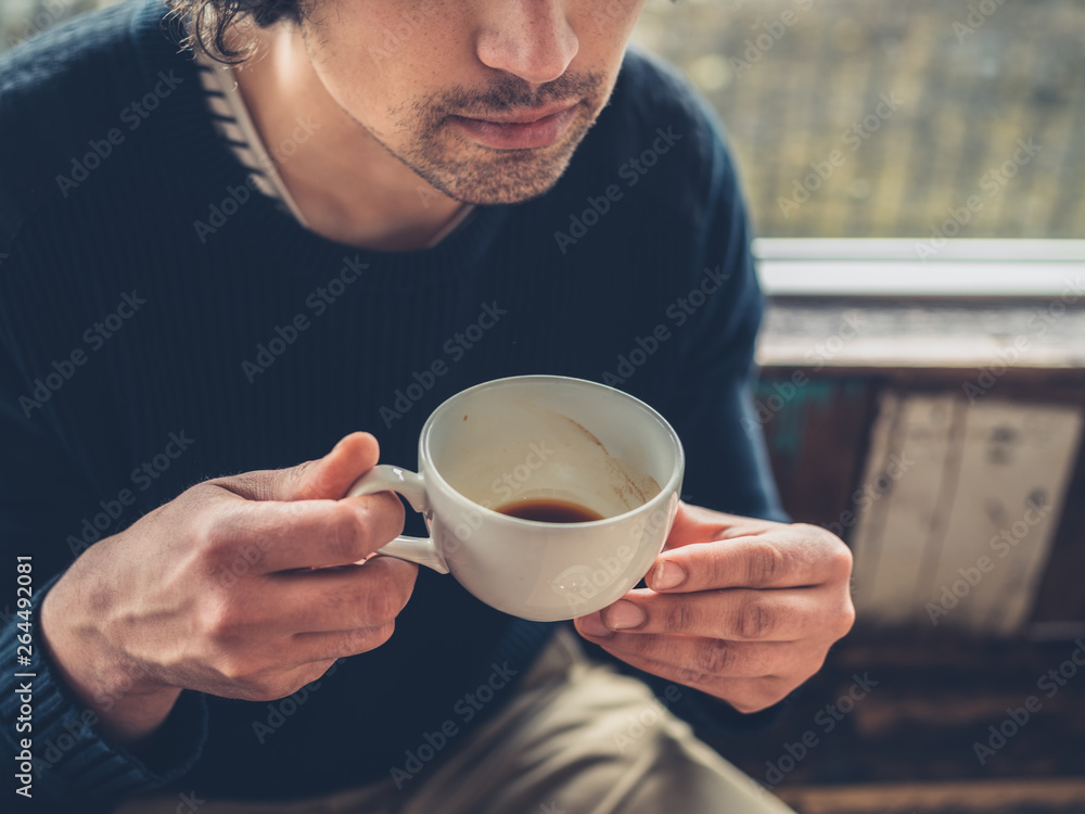 Man drinking coffee in a cafe Man drinking coffee in a cafe