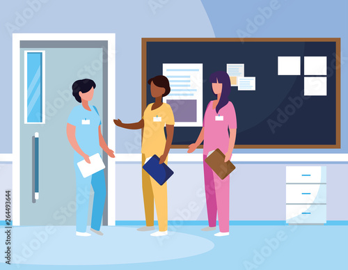 interracial female medicine workers in hospital corridor