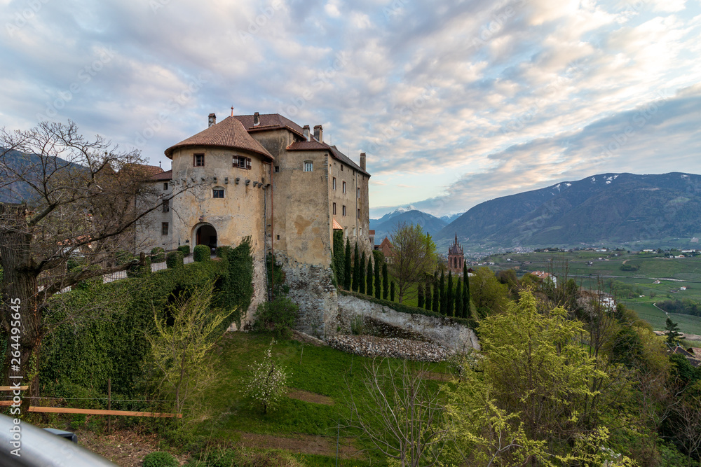 Panoramic view on Castle Schenna (Scena) near Meran during sunset. Schenna, Province Bolzano, South Tyrol, Italy.