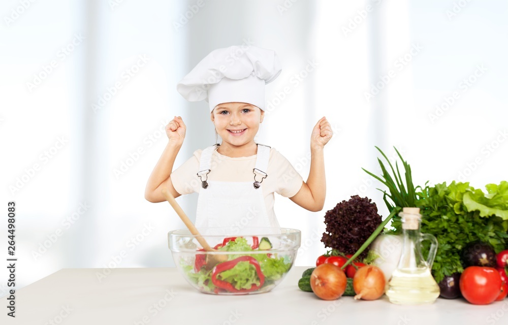 Portrait of adorable little girl preparing healthy food at kitchen Portrait of adorable little girl preparing healthy food at kitchen
