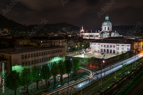 the Italian city of Como shot in a panorama from above with lights, traffic, buildings and the cathedral