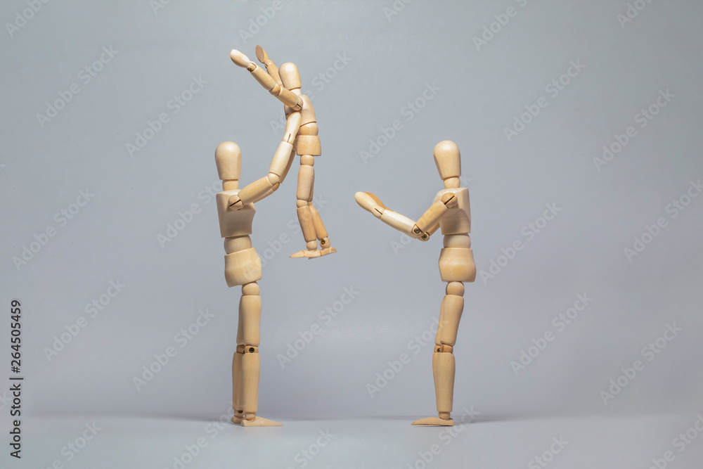 Wooden dummy family on with isolated background Wooden dummy family on with isolated background