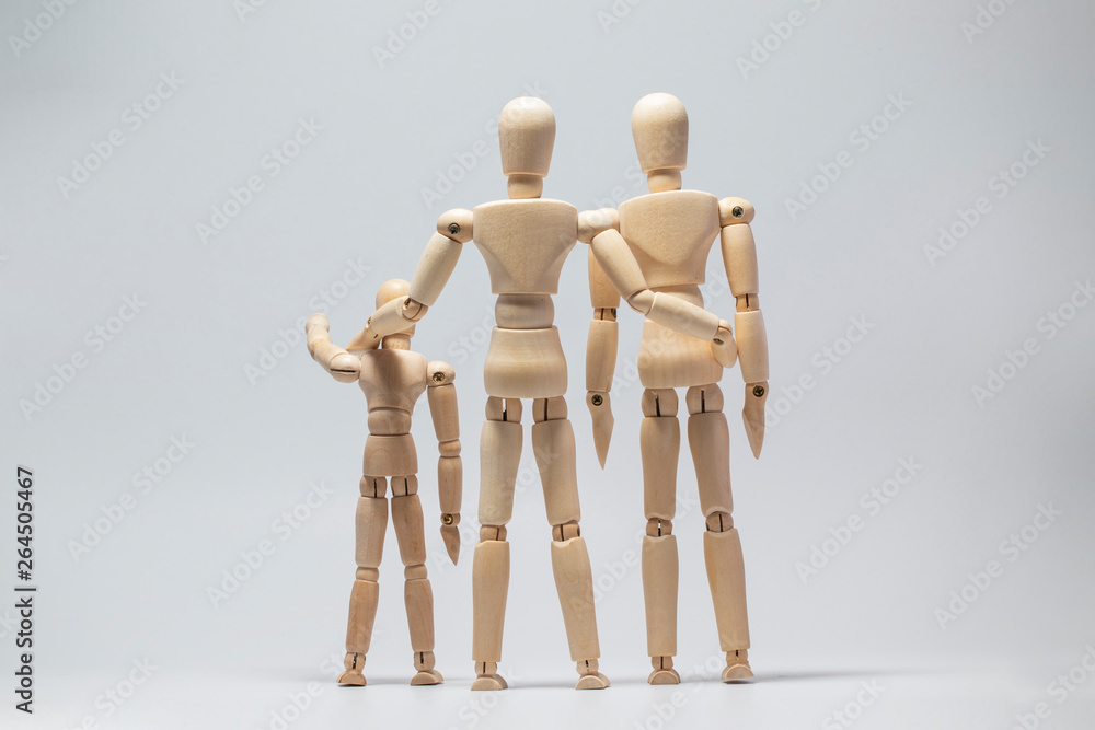 Wooden dummy family on with isolated background Wooden dummy family on with isolated background