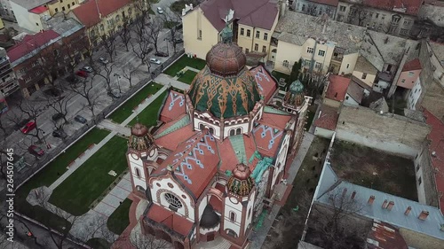 Colorful Synagogue Surrounded by Naked Winter Trees The Jakab and Komor Square Synagogue is a Hungarian Art Nouveau synagogue in Subotica, Serbia. It is the second largest synagogue in Europe. photo