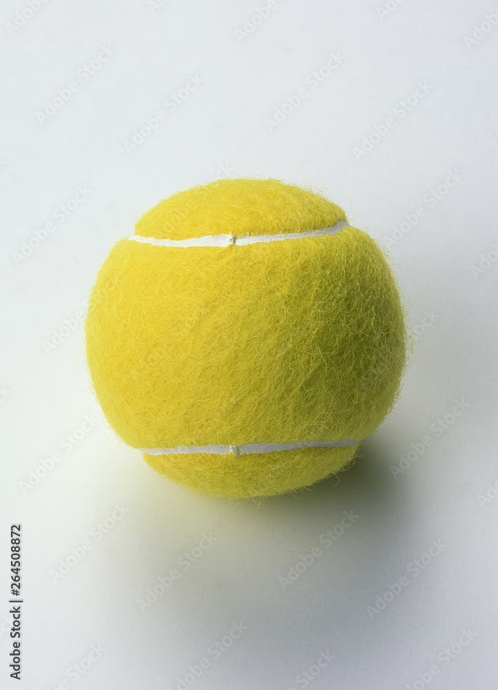 Single Tennis Ball on a White Background.
