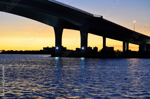 sunset below bridge facing clearwater florida photo