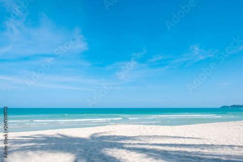 Landscape image of tropical white beach with blue sky background